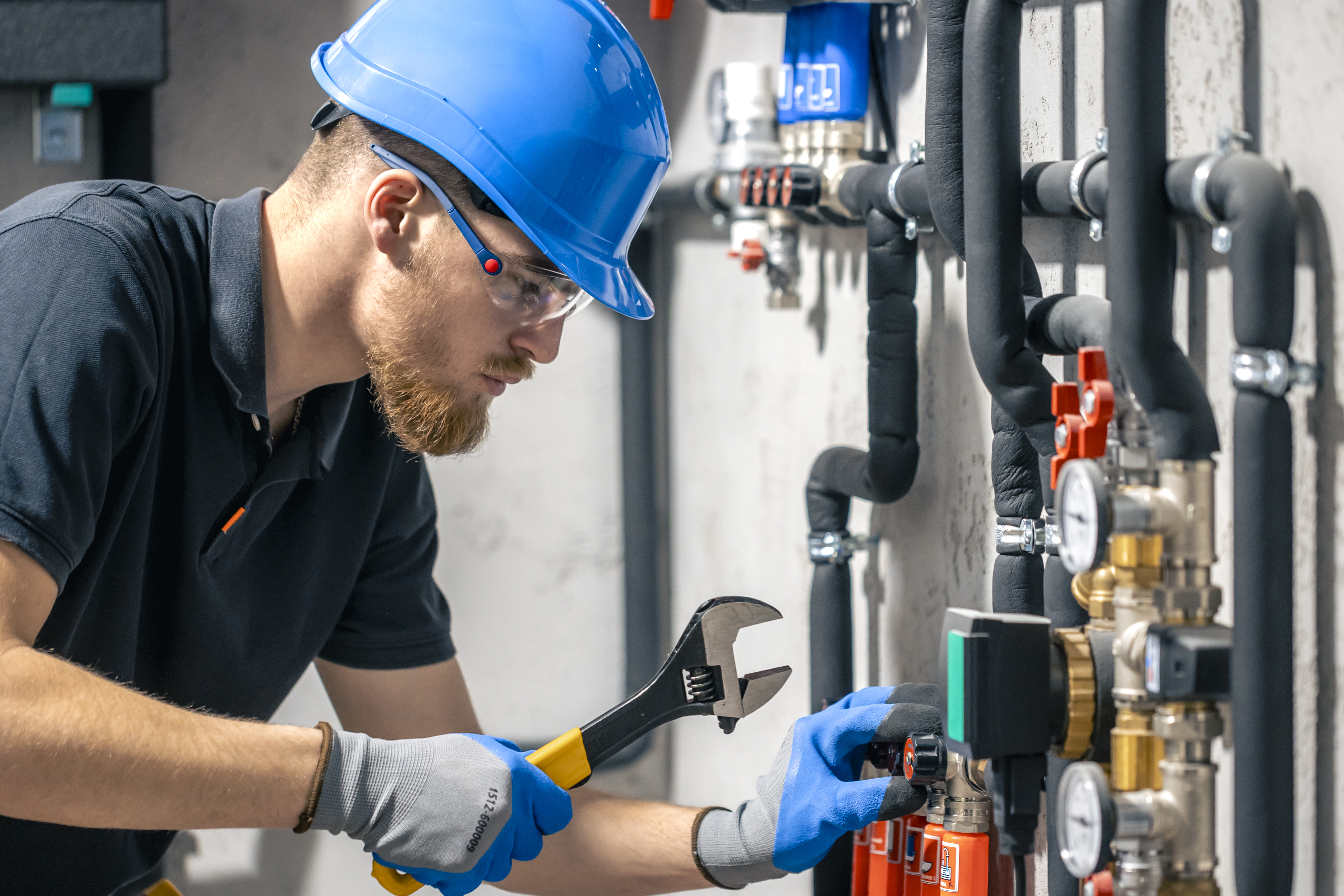 Mechanical contractor working on pipe installation
